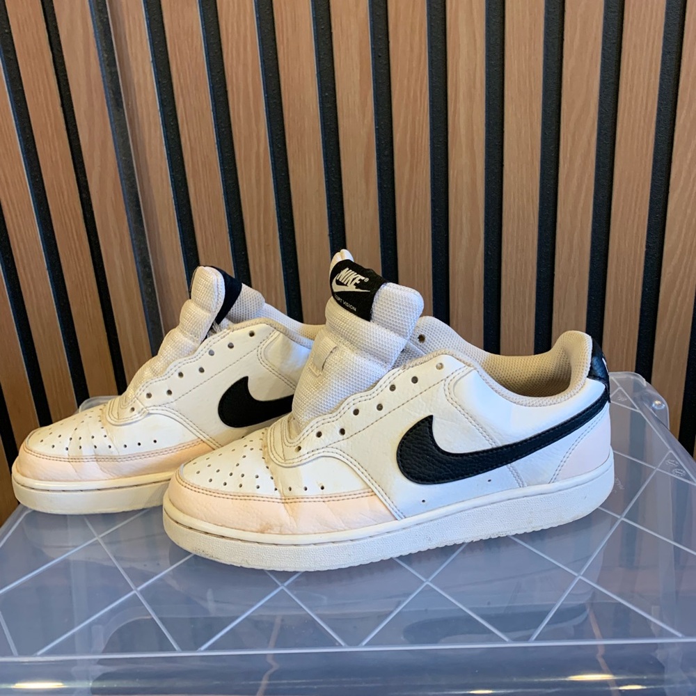 Nike Woman’s White Sneakers with Black Swoosh